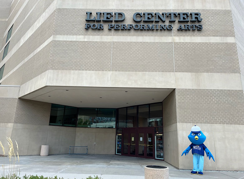 Person costumed as Nester in front of the Lied Center for the Performing Arts in Lincoln, Nebraska